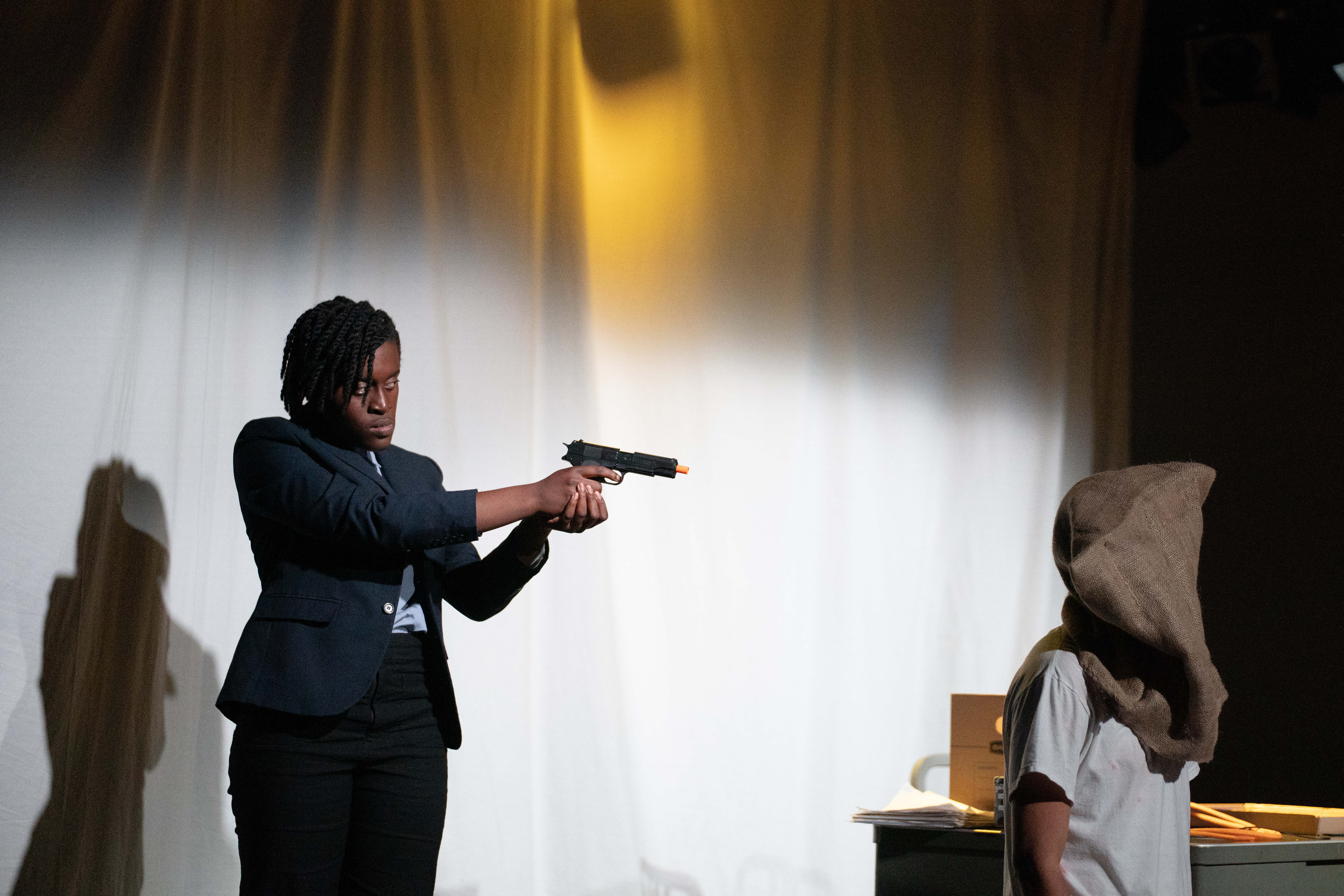 Tupolski pointing a gun